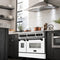 Autograph Edition 48 In. 6.0 Cu. Ft. Legacy Dual Fuel Range With 7 Burner Gas Cooktop And 2 Electric Ovens In Satin Stainless Steel With White Matte Doors And Matte Black Accents